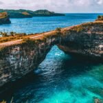 brown and gray bridge at middle of sea